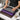 Close up comparison of different grip textures on professional Thai massage mats including high-grip PVC bumps and fabric backing