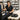 Mobile massage therapist adjusting the width of a portable massage table for safe transport and client comfort