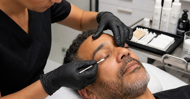 Professional lash and brow tint removal tools and applicators displayed on a clean station