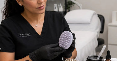 Professional scalp massage brush displayed among PureSpa Direct's collection, promoting hair health and relaxation.