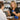 Comparison of glass and plastic cupping jars of varying weights and sizes for professional spa and massage therapy.