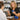 Comparison of glass and plastic cupping jars of varying weights and sizes for professional spa and massage therapy.