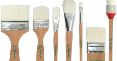 Professional 7 piece synthetic brush set for body and face self tanning application displayed on a white background