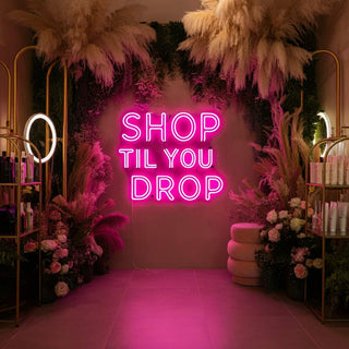 Shop Til You Drop Neon Sign in a vibrant spa setting