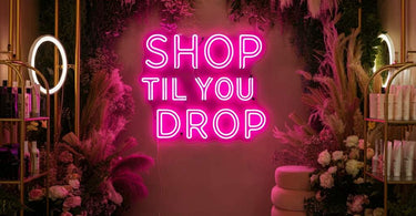 Shop Til You Drop Neon Sign in a vibrant spa setting