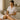 Esthetician applying numbing cream before waxing treatment