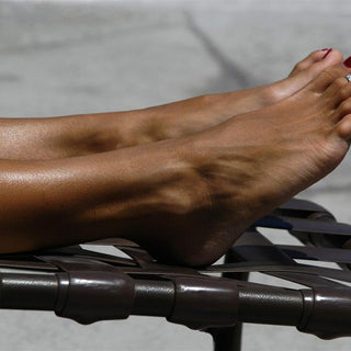 Step Up Your Spray Tanning Game with Black Strapless Sticky Sandals