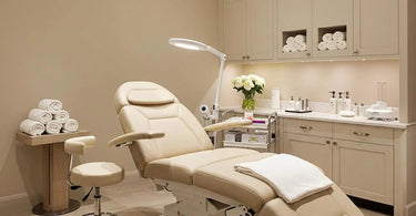 Luxury spa furniture including massage tables and pedicure chairs in a modern salon setting