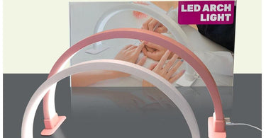 Gelaxy Half Moon LED Manicure Lamp in pink curing a client's gel nails