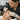 A professional esthetician performing a careful lash tinting service on a client in a clean, well-lit salon, highlighting safety and compliance with state board regulations.