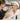 Woman receiving a patch test for brow tinting on her arm with a mixing palette and applicator brush visible nearby.