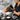 Color bar organization with professional hair color tubes and mixing bowls arranged neatly on a salon counter
