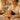 A massage therapist's hands performing a gentle assessment on a client's neck and shoulders, demonstrating the initial pressure check technique in a serene spa setting.