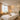 A serene spa treatment room with acoustic wall panels, soft lighting, and a massage table, emphasizing quiet and relaxation.