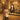 Spa reception area with friendly staff helping a walk-in client while appointment book shows full schedule