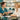 A spa professional engaging in a warm, focused consultation with a client, both smiling and discussing treatment options.