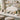 A beautifully arranged product test station in a spa or salon retail area featuring skincare testers, applicators, and retail products on a marble countertop.