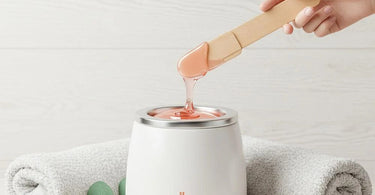 Professional esthetician performing a precise waxing treatment on sensitive skin