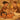 Two massage therapists performing synchronized four-hand massage on client in spa setting