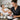 A busy professional esthetician working on a client in a calm, appointment-only spa environment.