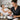 A busy professional esthetician working on a client in a calm, appointment-only spa environment.