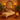 Esthetician holding mirror for client during facial treatment in spa setting