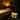 A woman's hand placing a stylish leather purse on a sleek shelf in a serene, well-lit spa treatment room