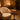 A woman's hand placing a stylish leather purse on a luxurious spa stool in a serene treatment room