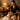 Woman enjoying a spa facial treatment with glowing skin, surrounded by candles and wellness products