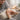A serene image of a gentle hand massage during a manicure, with soft focus and warm lighting, evoking peace and quiet care.