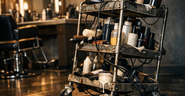 A professional and sturdy stainless steel salon trolley fully stocked with colorful beauty products and tools, contrasted with a flimsy, empty plastic trolley in the background to represent the hidden costs of cheap equipment.