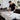 An overhead image illustrating the hidden cost and hygiene issues of using cheap table paper in professional spa, massage, and waxing treatment rooms.
