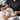 Spa receptionist politely declining a walk-in client with a warm smile, featuring a modern spa reception desk and scheduling software.