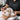 Spa receptionist politely declining a walk-in client with a warm smile, featuring a modern spa reception desk and scheduling software.