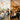 Spacious and bright modern salon interior with high ceilings, exposed beams, and elegant pendant lights creating a luxurious ambiance for clients and stylists.