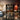 A stylish spa treatment room featuring a neutral wall color complementing a luxurious massage table and wooden side table, showcasing the perfect harmony between wall color and furniture material choices.