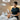 Esthetician providing waxing aftercare instructions to a client in a spa setting
