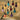 A vibrant assortment of nail polish bottles organized by color family, showcasing tones and shades from light to dark