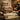 A luxurious modern pedicure chair in a serene spa setting, showcasing plush upholstery, a built-in foot spa basin, and elegant salon decor.