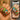 Comparison showing the same nail design as it appears on a phone screen versus in real life on a client's hand