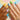A close-up image of a manicurist shaping a client's nails, showcasing the precision and care that goes into creating the perfect nail shape.