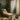A serene spa client taking a deep breath during a facial treatment, with soft lighting and a relaxed atmosphere.