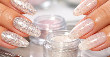 Close-up of sparkling diamond-flecked acrylic nails with glitter encapsulated in the structure, showcasing professional nail art.