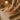 A spa professional's hands performing a soothing massage on a client's back in a serene treatment room.
