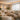 A beautifully designed spa lounge with comfortable seating, warm lighting, and serene decor, showcasing an inviting waiting area.