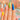 A variety of nail extension styles, from short and natural to long and dramatic, displayed on a salon table with tools and polish.