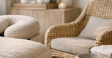 A luxurious spa treatment room featuring a plush, textured massage table with soft linens, warm lighting, and a serene atmosphere, highlighting the importance of tactile comfort in spa furniture.
