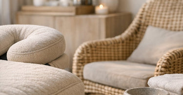 A luxurious spa treatment room featuring a plush, textured massage table with soft linens, warm lighting, and a serene atmosphere, highlighting the importance of tactile comfort in spa furniture.