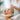 A serene spa treatment showing a client receiving a gentle facial application, highlighting the professional use of advanced prebiotic and probiotic skincare products.