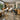 Eco-friendly bamboo and recycled material furniture for a modern, sustainable spa or salon interior, featuring a stylish treatment table and stool.